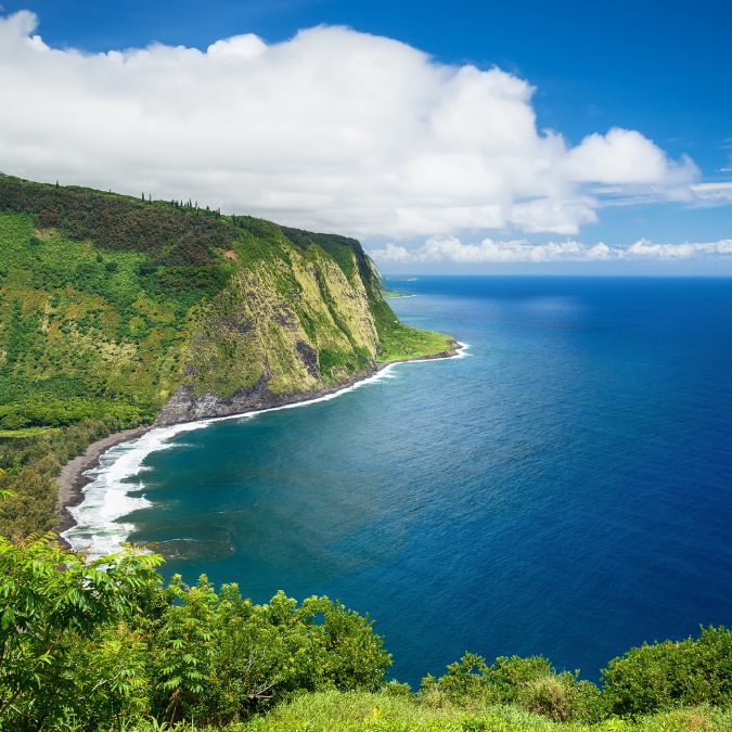 big island coast with water and green mountains 