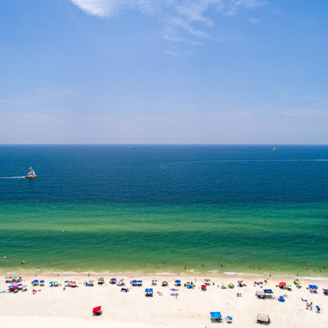 gulf shores alabama beach with ocean and beach in forground