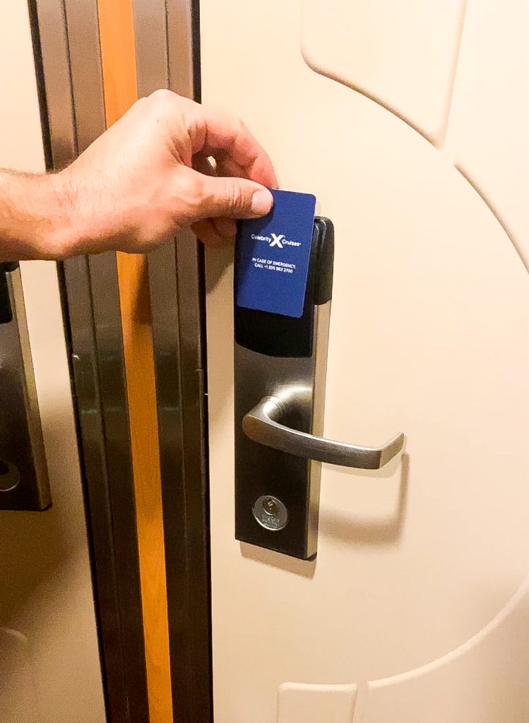 celebrity cruise ship room key about to open the door