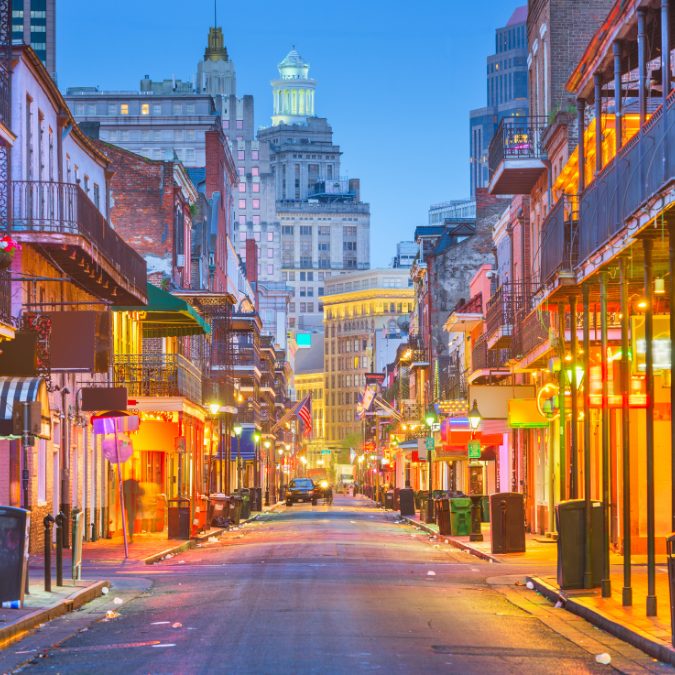 new orleans road with bright lights and buildings