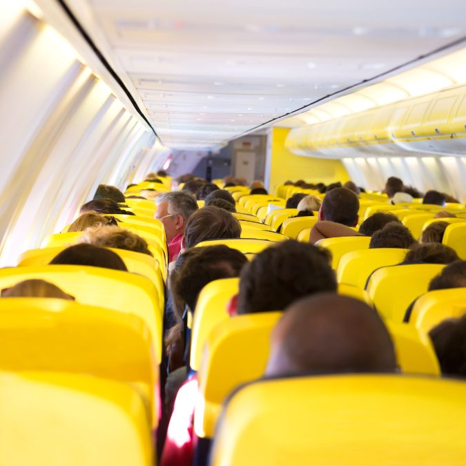 inside an airplane with yellow seats