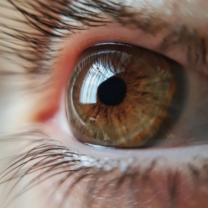 close up of brown eyeball with reflection