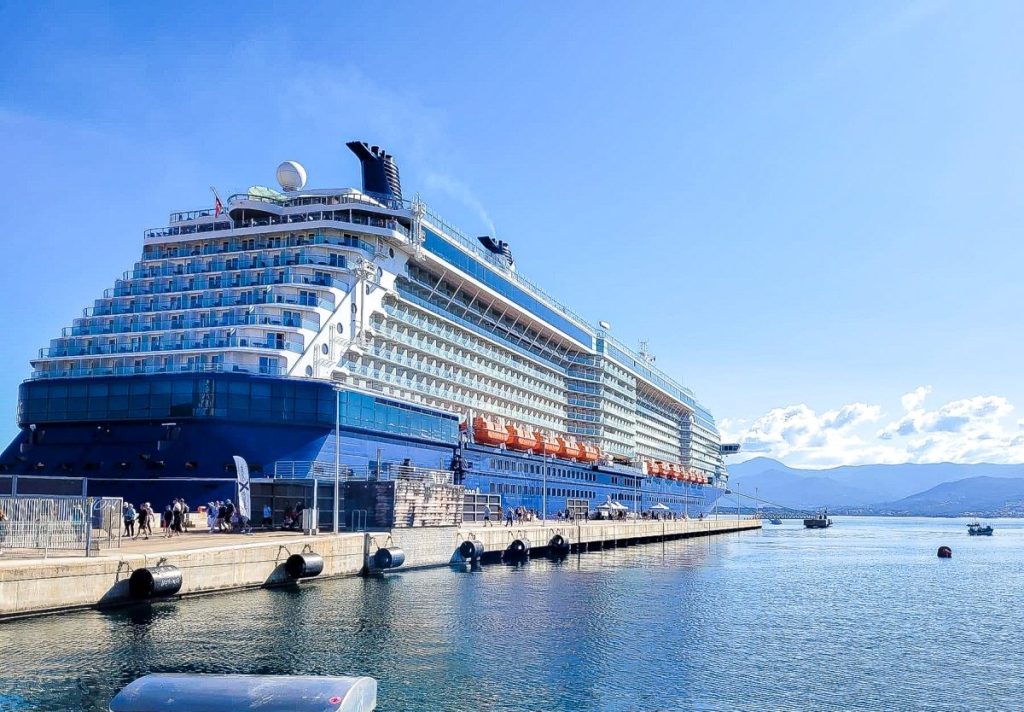 photo of blue cruise ship on the ocean