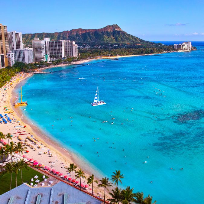 city and beach and blue waters of hawaii