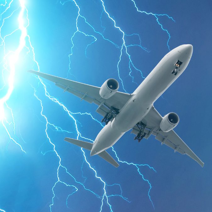 plane in the blue sky with lightning can a plane fly in a thunderstorm 