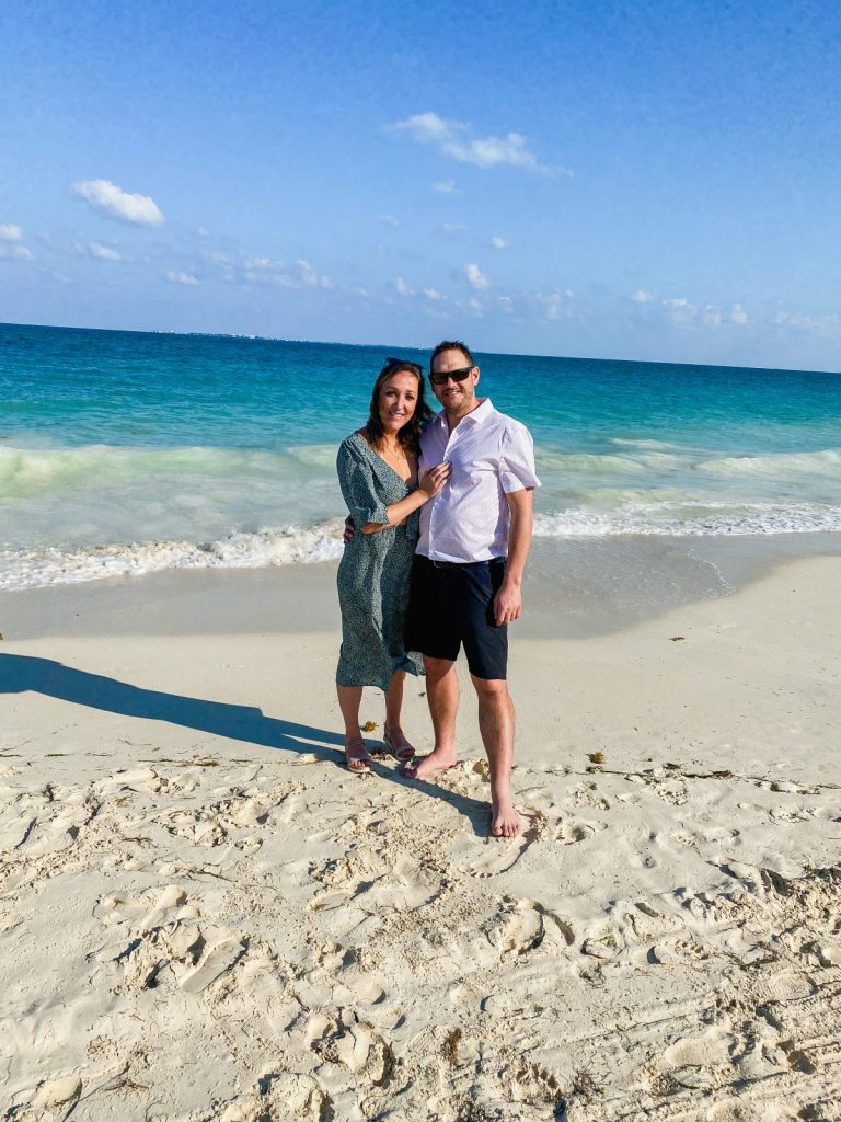 front view of a couple on beaches in Mexico with ocean in background