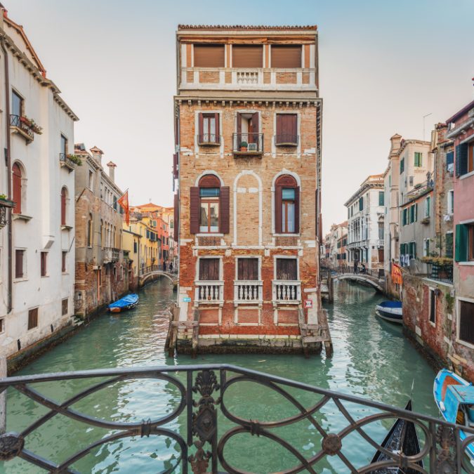 canals in italy with building 