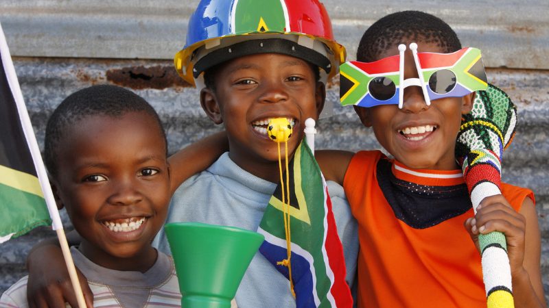 3 children from south africa with flags