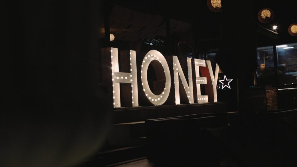 big honey sign with bright lights
