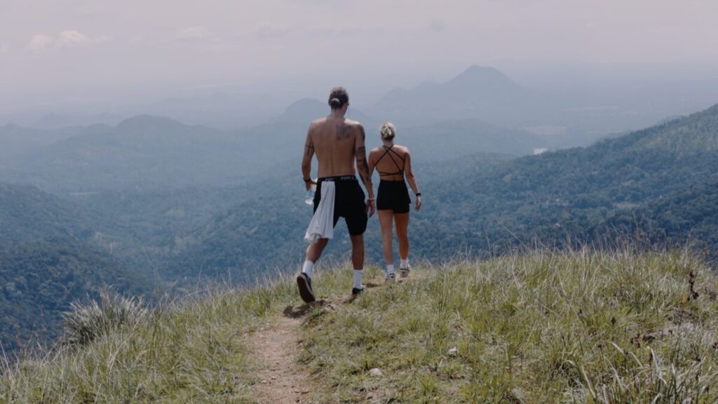 man and woman on path on little adams peak