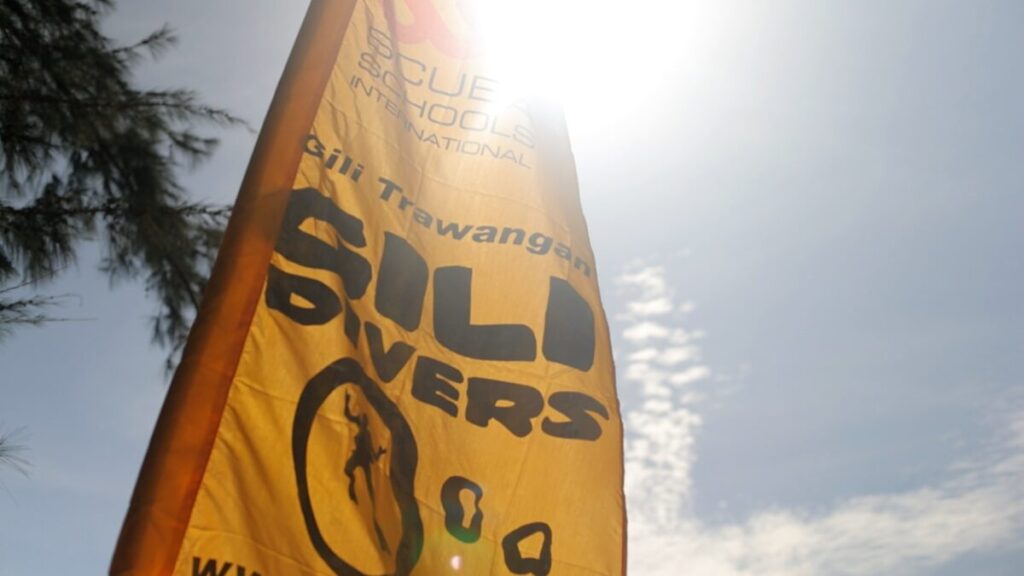 yellow gili divers sign in the sun 